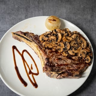 Rib Steak with Sauteed Mushrooms